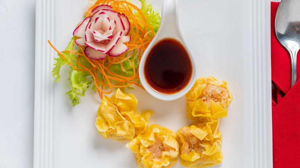 Thai Dumpling (4 Pieces) · Steamed ground shrimp or pork wrapped with wonton skin. Serve with light brown sauce.