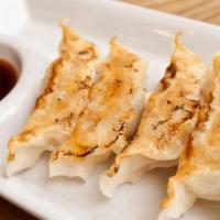 Pot Sticker · Deep fried pot stickers stuffed with seasoned vegetables and chicken