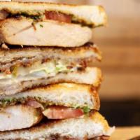 Chicken Club Sandwich  · Grilled Chicken - Guacamole - Mayo - Bacon - Cheddar - Tomato - Lettuce - Pickle