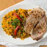 Pernil De Puerco · Roast pork server with arroz con gandules (pigeon pea rice) and yuca con mojo.