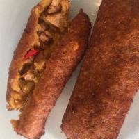 Alcapurria  · Two puerto rican plantain fritter with pork.
