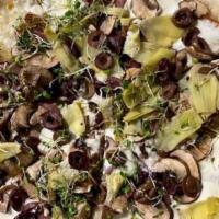 Capriciosa · Fresh mozzarella, prosciutto di parma, artichokes, crimini mushrooms, kalamata olive and loc...