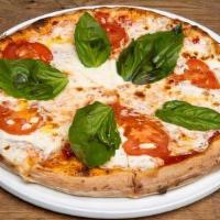 Margherita Pizza · Fresh mozzarella, fresh tomatoes, fresh basil and EV Olive oil