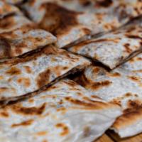 Beef Gozleme · Thin flaky pastry with ground beef.