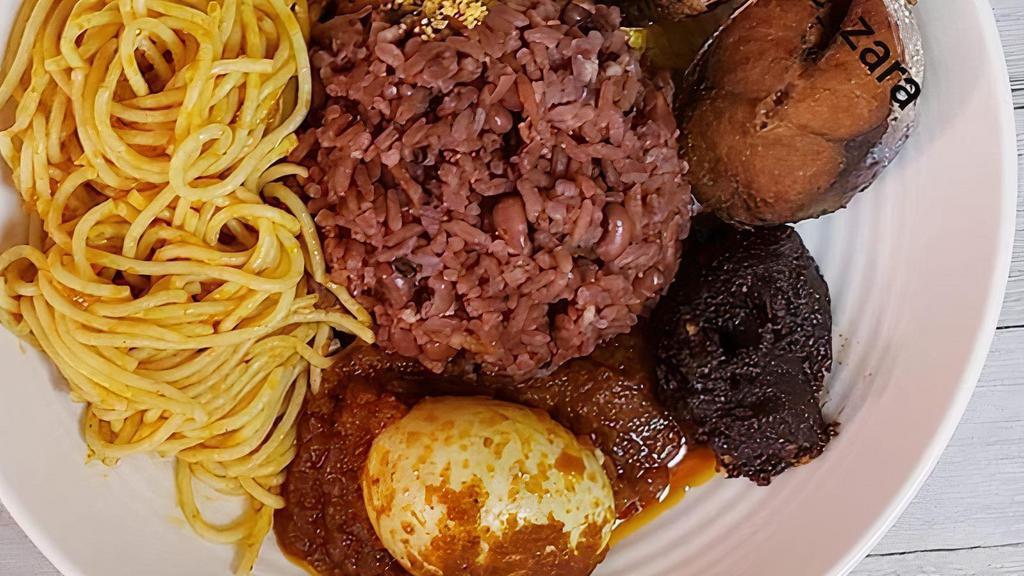 Ayimolou (Togo) · Comes with Chicken or fish, boiled egg, spaghetti, plantain. and spicy onion and Tomato sauce