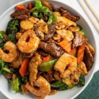 Steamed Triple Delight · Shrimp, chicken and beef with mixed vegetables.