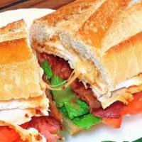 Hot Chipotle (Hot!) · Chipotle chicken, chipotle gouda, bacon, lettuce, tomato, onion, Ana mayo on toasted French ...