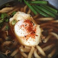 Ramen Noodle Soup · Wheat noodles, seasoned pork belly, bamboo shoot, sweet comed, boiled egg top with scallions.
