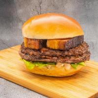Pork Belly Burger · Two 3oz. patties topped with two pieces of pork belly with a savory glaze, romaine lettuce a...