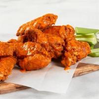 Spicy Wings · Ten deep-fried crispy wings tossed in a sweet & spicy Sriracha glaze and served with spicy m...