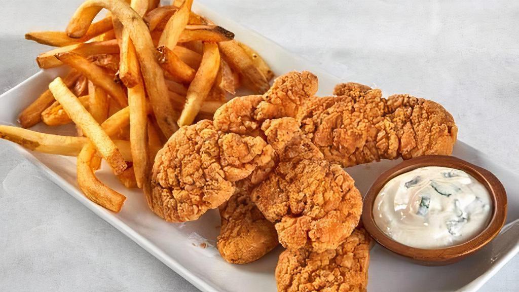 Buffalo Chicken Tenders · Chicken tenders cooked golden-brown and crispy, tossed in a medium buffalo sauce, and served with fries and a side of blue cheese or ranch dressing