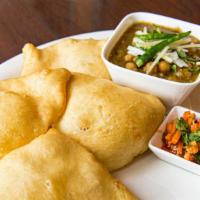 Cholle Bhature · Chick peas served with deep fried flour puri.