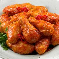Wings Of Fire · BB wings brushed with our Hot Spicy sauce.