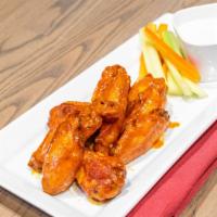 Rotisserie Wings · Eight wings, traditional or BBQ, celery, carrots, bleu cheese dressing.