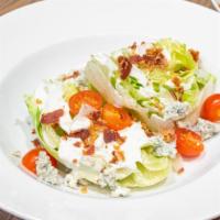 Wedge Salad · Iceberg, bleu cheese crumbles, grape tomato, bacon, bleu cheese dressing. Add chicken or sal...