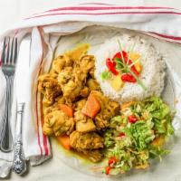 Curried Chicken · Served with rice and peas or white rice.