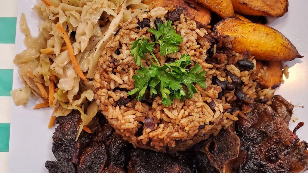 Oxtail · Served with rice and beans, cabbage, plantains