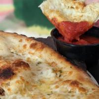 Cheesy Bread · Fresh baked bread topped with garlic butter and mozzarella cheese served with your choice of...