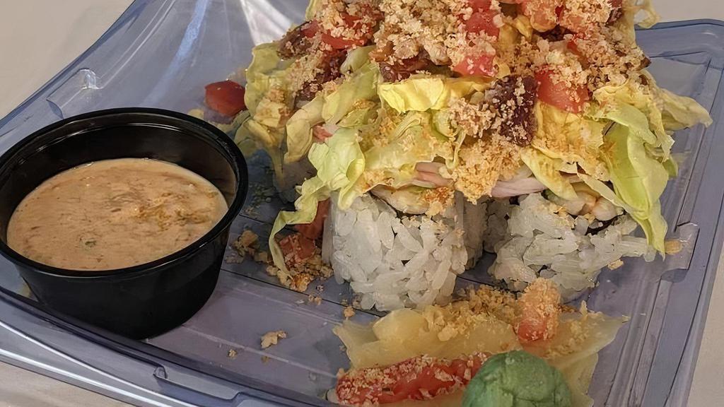 Shrimp Blt Yama Maki · Shrimp and Avocado roll topped with Kanikama, Spiced Bacon, Bibb Lettuce,  Tomato, Buttered Toast Crunch, and Kimchi Remoulade.
