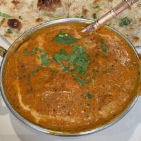 Channa Masala · Garbanzo beans cooked with select Indian spices in rich tomato curry sauce.