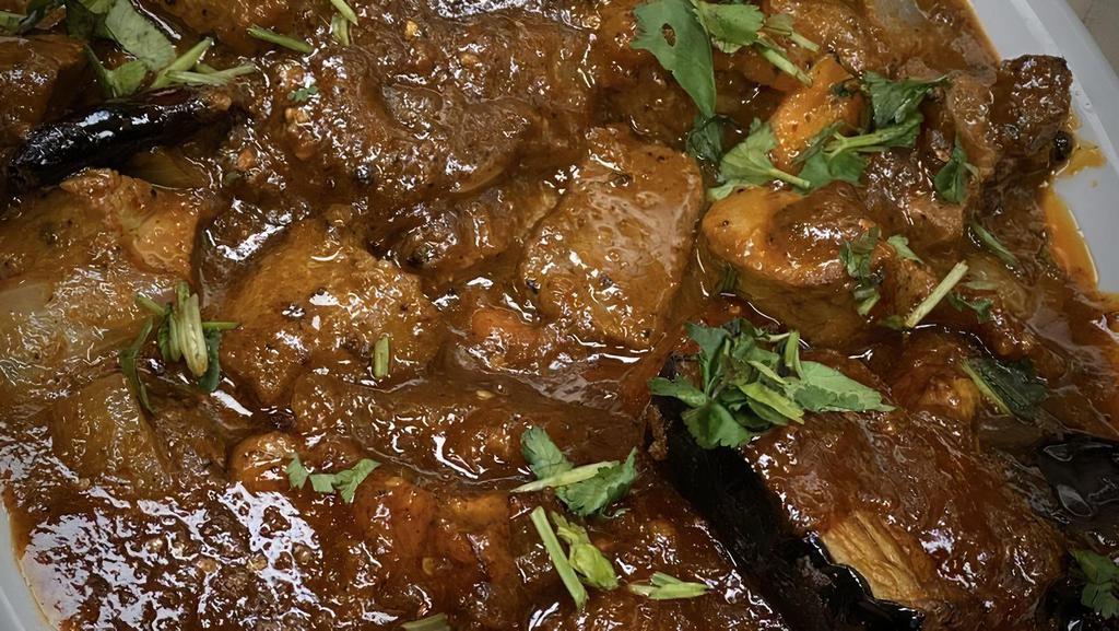 Lamb Curry · Boneless cubes of lamb cooked in a rich tomato curry.