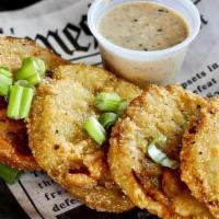 Fried Green Tomatoes · 3 Green tomatoes battered and fried served with our signature jerk ranch
