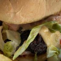 Jam-I-Can Burger · Double jerk beef patty, fried green tomatoes, fried pickles, garlic aioli,  spicy mustard. o...