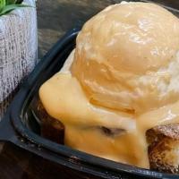Pina Colada Bread Pudding · Warm sweet bread pudding infused with our pina colada flavors, coconut and soaked rum raisin...