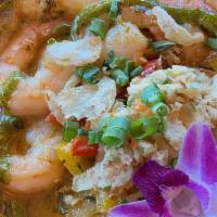 Shrimp And Grits · Sauteed shrimp, peppers, onions in herb butter broth, on top of our cheesy grits, garnished ...