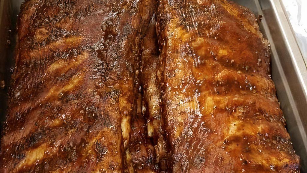 Full Rack Ribs · A full rack is 12 bones. . Our ribs are rubbed and marinated with southern spices, then smoked to perfection on flavored wood.. (1 DAY ADV NOTICE FOR 3 SLABS OR MORE )