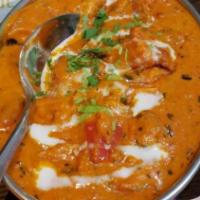 Chicken Tikka Masala · Chunks of roasted chicken marinated and cooked in creamy sauce and home spices.
