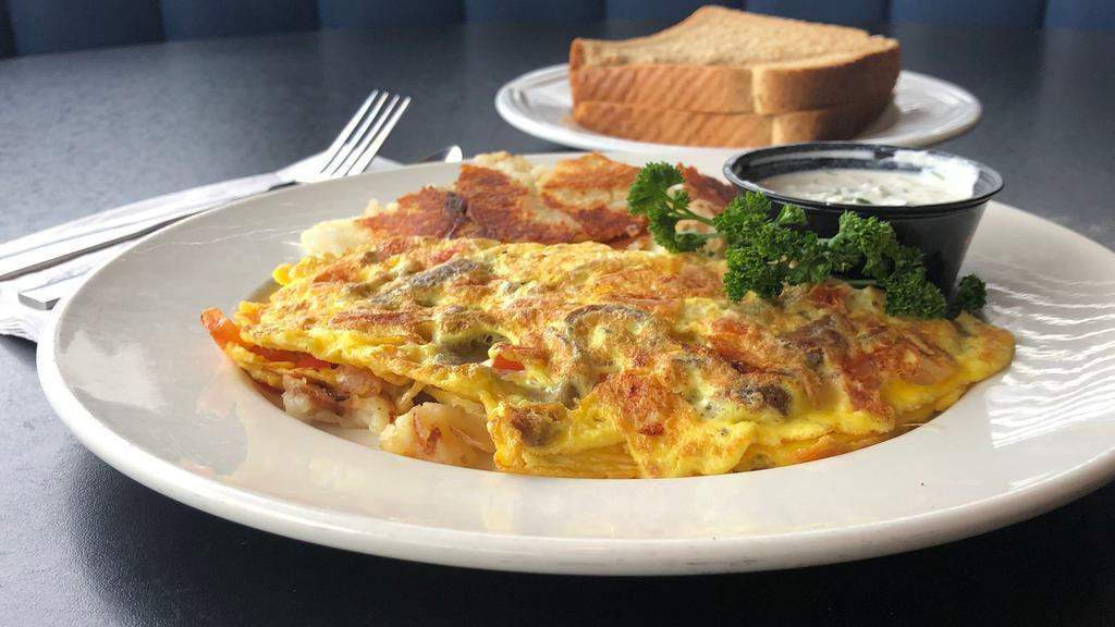 Zorba Omelet · A true grecian delight gyro meat, feta cheese, and tomato, served with tzatziki sauce.