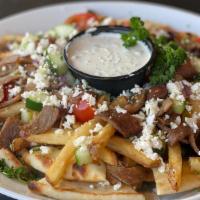 Greek Nachos · Gyro, feta cheese, olives, tomato, cucumber, French fries on toasted Pita bread, served with...