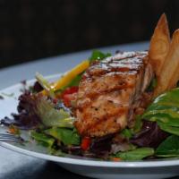 Glazed Salmon Salad · Honey glazed pan seared salmon with beans, shallots, basil, and tomatoes on a bed of baby fi...