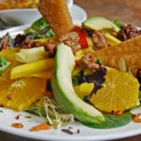Caribbean Salad · Baby field greens, tossed with mangoes, avocados, red peppers, orange wedges, and caramelize...