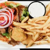 Gyro Sandwich · This grecian favorite is a spicy combination of beef and lamb thinly sliced on pita, topped ...