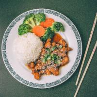 Sesame Chicken & Vegetables · Gluten-free. Lightly battered tender chicken tossed in tangy sesame sauce and topped with se...