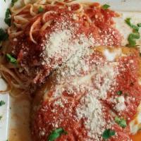 Chicken Parmigiana · Breaded chicken topped with mozzarella and homemade tomato sauce served over linguini.