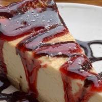 Homemade Cheesecake · Homemade New York-style cheesecake, cookie crust, and chocolate sauce.