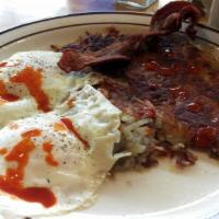 Country Breakfast · Includes one biscuit and country sausage gravy, Hash Browns, 2 eggs* & choice of 2 link saus...