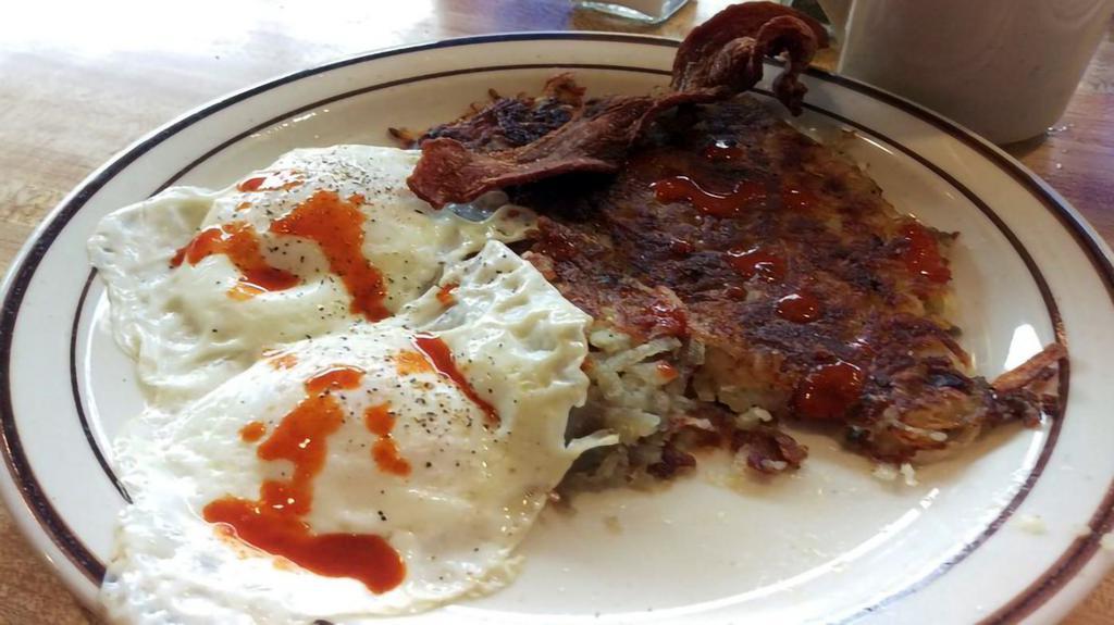 Country Breakfast · Includes one biscuit and country sausage gravy, Hash Browns, 2 eggs* & choice of 2 link sausage or 2 bacon strips or sausage patty.