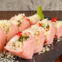 Pink Lady Roll · Spicy tuna, crab, avocado, seaweed inside wrapped with pink soy paper with tobiko and tempur...