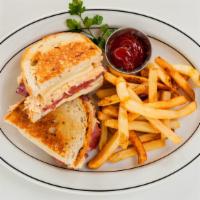 Reuben · Corned beef, sauerkraut, and Swiss cheese on rye. Served with French fries.