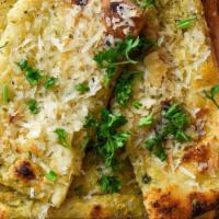Garlic Bread · Loaf baked daily in our brick oven with Parmesan garlic butter. Sliced and served with EVOO ...
