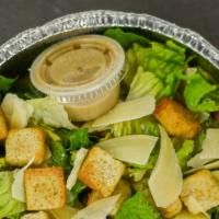 Large Caesar Salad · Romaine lettuce and shaved parmesan with croutons. Caesar dressing on the side.