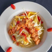 Grilled Shrimp & Mango Salad · Marinated grilled shrimp on skewers served with Shredded mango, green papaya, red peppers, c...