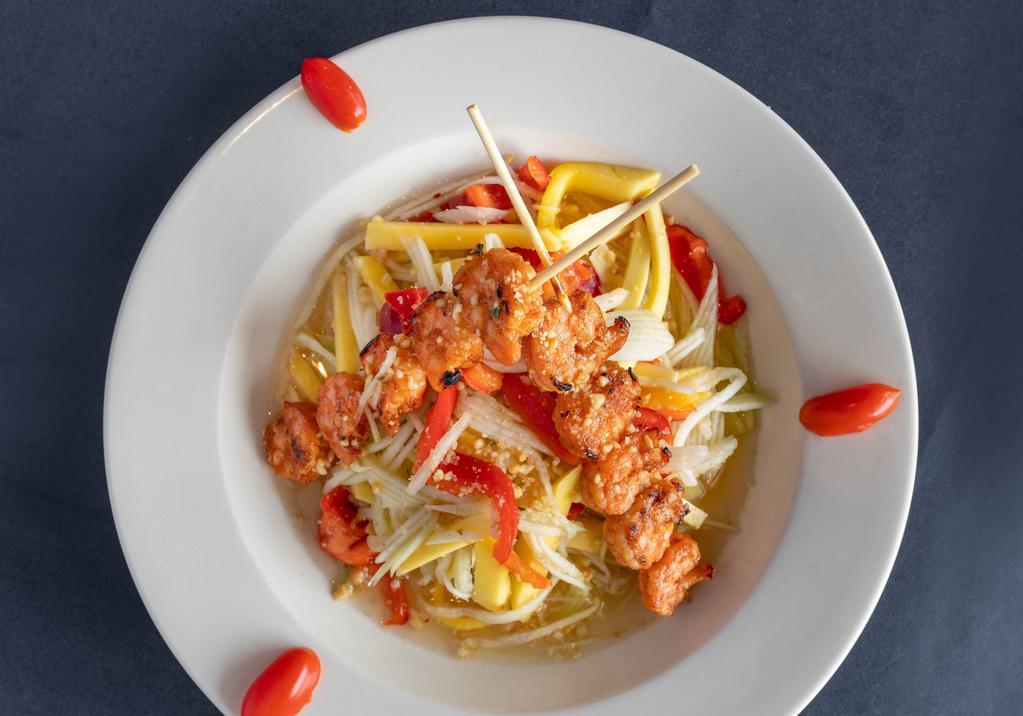 Grilled Shrimp & Mango Salad · Marinated grilled shrimp on skewers served with Shredded mango, green papaya, red peppers, cilantro and ground peanuts topped with our thai vinaigrette.