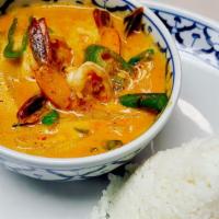 Gang Dang · Hot. Red curry and coconut milk with bamboo shoots, bell peppers, onions, lime leaves and ba...