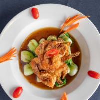 Bangkok Shrimp · Lightly breaded shrimps topped with chopped scallop and chefs special brown sauce garnished ...