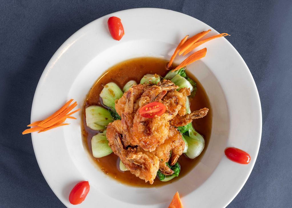 Bangkok Shrimp · Lightly breaded shrimps topped with chopped scallop and chefs special brown sauce garnished with baby bok choy.